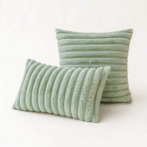 light green, ribbed plush pillows in a white background.